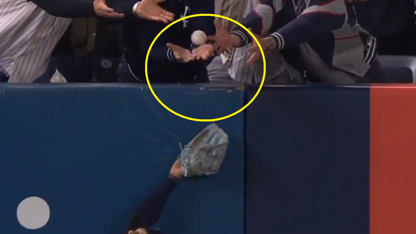 A New York Yankees fan committing interference