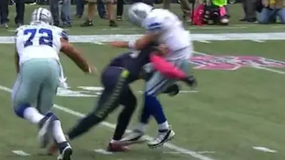 Tony Romo Bobby Wagner hit