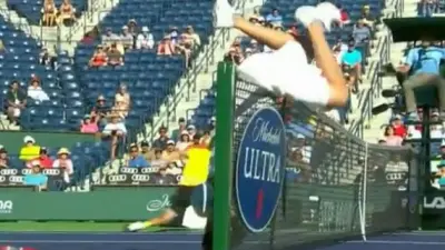 Mardy Fish flips over net