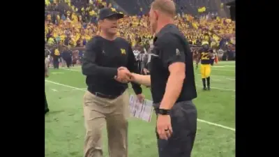 Scott Frost Jim Harbaugh handshake