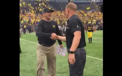 Scott Frost Jim Harbaugh handshake