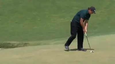 Phil Mickelson moving ball