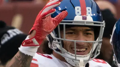 Evan Engram holding up a hand