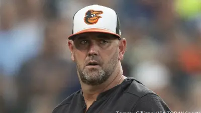 Brandon Hyde in his Orioles hat
