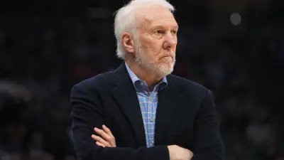 Gregg Popovich with arms folded