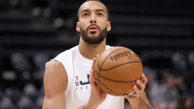 Rudy Gobert holding a basketball