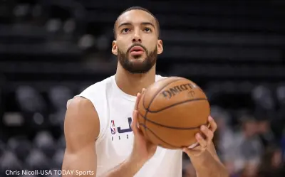 Rudy Gobert holding a basketball