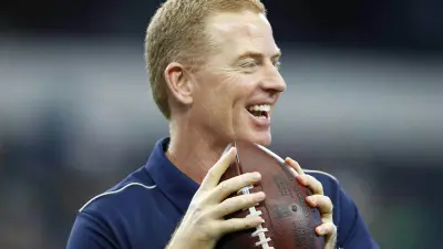 Jason Garrett holding a football