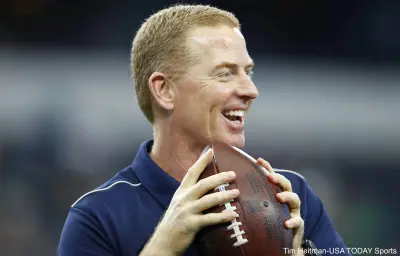 Jason Garrett holding a football