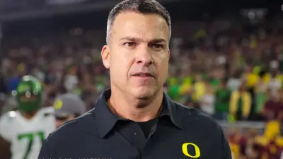 Mario Cristobal in an Oregon shirt
