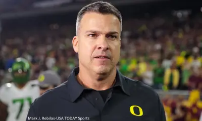 Mario Cristobal in an Oregon shirt