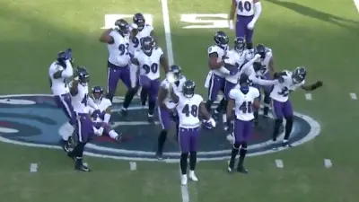 Ravens stomp Titans logo