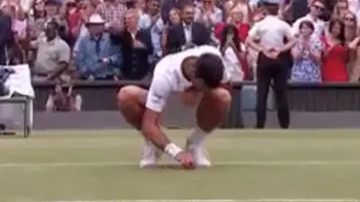 Novak Djokovic eats grass