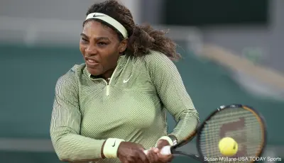 Serena Williams hits a ball