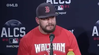 Kyle Schwarber wears a Waltham shirt