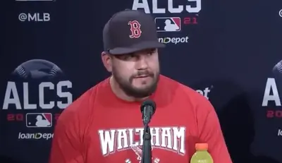 Kyle Schwarber wears a Waltham shirt