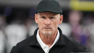 Mike Mayock wearing a hat