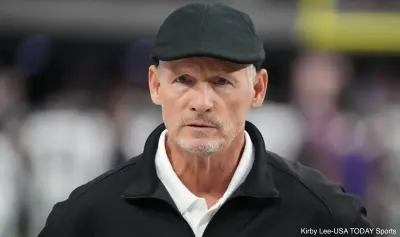 Mike Mayock wearing a hat