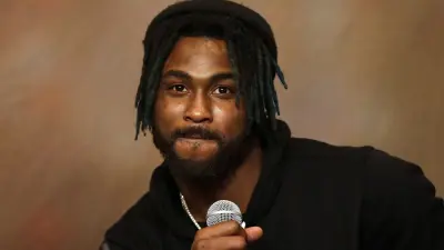 Bashaud Breeland holds a microphone