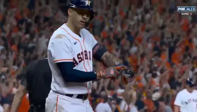 Carlos Correa points at his wrist