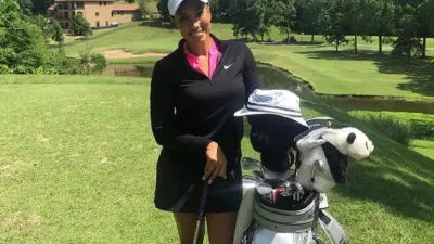 Cheyenne Woods with her golf bag