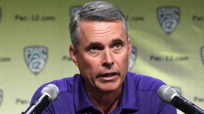 Chris Petersen at a press conference