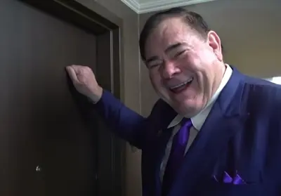 David Baker knocks on a door