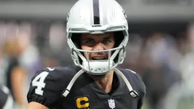 Derek Carr with a helmet on