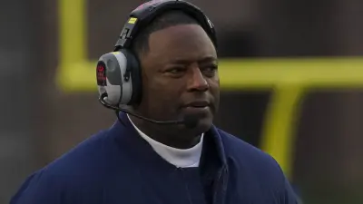 Dino Babers wearing a headset