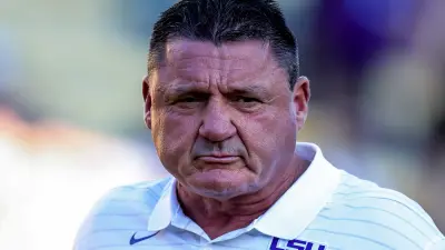 Ed Orgeron in a white LSU shirt