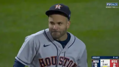 Jose Altuve looks sheepish after an error