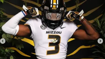 Luther Burden in a Missouri helmet
