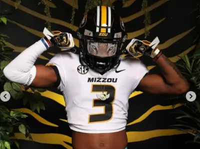 Luther Burden in a Missouri helmet