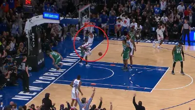 Obi Toppin hangs on the rim