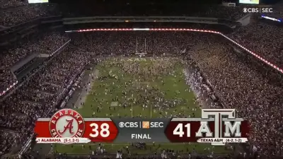 Texas A&M fans storm field