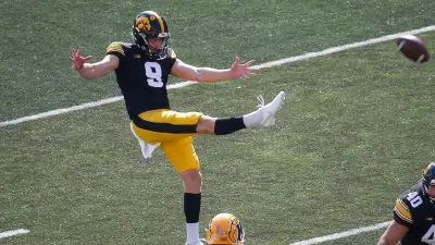 Tory Taylor punts