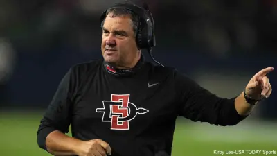Brady Hoke signals to his players