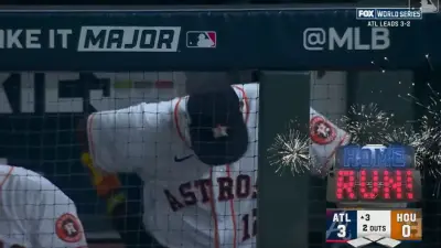 Dusty Baker with his head down in the dugout