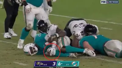 Jacoby Brissett grabs his knee