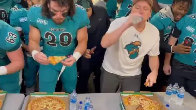 Joey Chestnut eats pizza