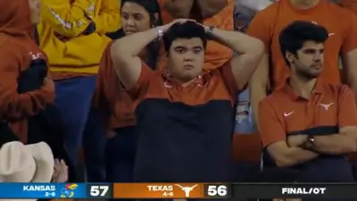 A Texas fan does the surrender cobra