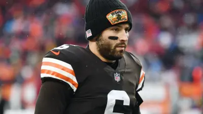 Baker Mayfield stands on the sideline