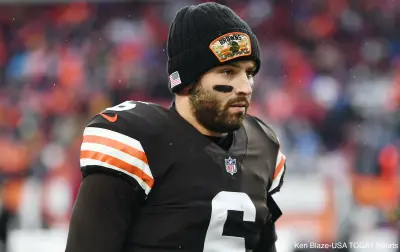 Baker Mayfield stands on the sideline