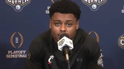 Coby Bryant speaks with reporters