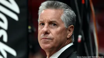 Neil Olshey looks on at a Blazers game