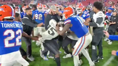 UCF and Florida players get into a postgame scrum