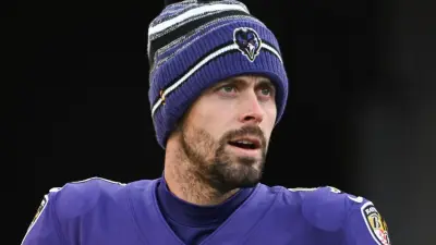 Justin Tucker looking on