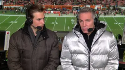 Kurt Warner wearing a silver jacket