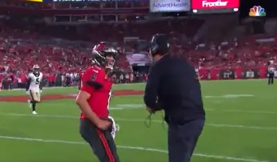 Tom Brady approaches Dennis Allen