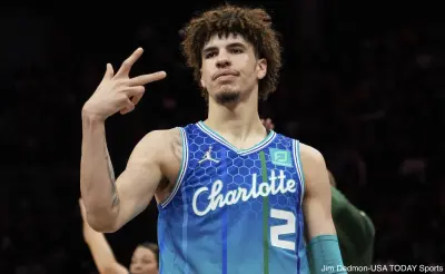 LaMelo Ball makes a hand gesture